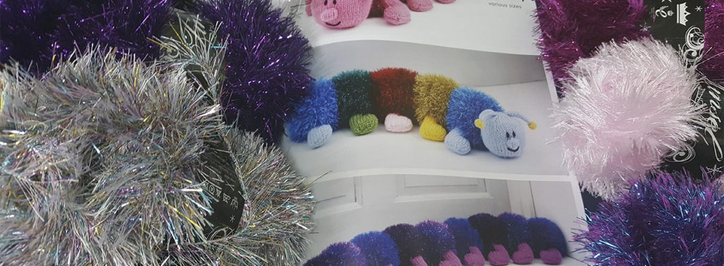 Balls of wool on wooden background